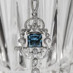 Touch of Silver Gold & Old - A gorgeous 1.02 carat blue diamond in a white gold and white diamond setting.