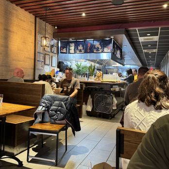 Purinsu Ramen - people sitting at tables in a restaurant - Ramen Near Me - Princeton, New Jersey Purinsu Ramen - people sitting at tables in a restaurant - Ramen Near Me - Princeton, New Jersey