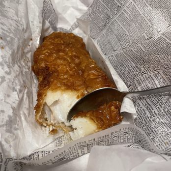 Phil’s Fish & Chips - a piece of fish and chips in a wrapper - Fish & Chips Near Me - Quebec City, Quebec