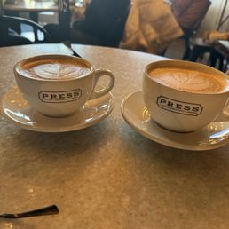 One Banana Bread Latte and one 8 oz. Cappuccino