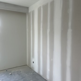 Precision Remodeling - a room with drywalled walls - Drywall Installation & Repair Near Me