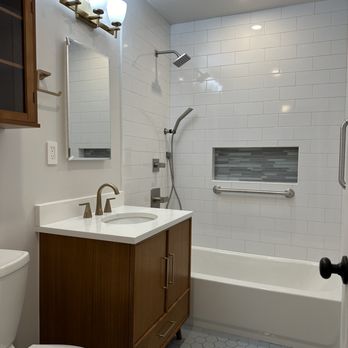 KV Builders - a bathroom with a sink, toilet, and bathtub - General Contractors Near Me