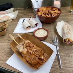 Kanarie Club - Chicken with peanut sauce, veggie wraps, duck spring roll, hummus.