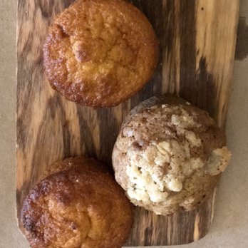 Bistro Off Broad - Pre-meal muffins served on a wooden board. - French Near Me - Winder, Georgia