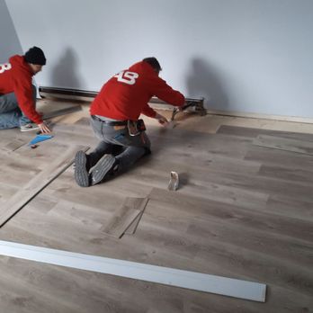 AB Improvements - two men working on a wood floor - Tiling Near Me - Port Washington, Wisconsin AB Improvements - two men working on a wood floor - Tiling Near Me - Port Washington, Wisconsin