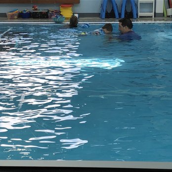 Flying Fish Swim Academy - Coach Aaron working his magic - Swimming Lessons/Schools Near Me - Dripping Springs, Texas Flying Fish Swim Academy - Coach Aaron working his magic - Swimming Lessons/Schools Near Me - Dripping Springs, Texas