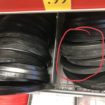 QuikTrip - a stack of black and red plastic discs - Convenience Stores Near Me - EULESS, Texas
