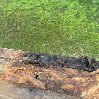 TC Integrity Building - a piece of wood that has been burned - Roofing Near Me TC Integrity Building - a piece of wood that has been burned - Roofing Near Me