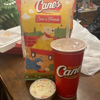 Raising Cane's Chicken Fingers - a cup of coleslaw and a bag of coleslaw - Fast Food Near Me - Mansfield, Texas Raising Cane's Chicken Fingers - a cup of coleslaw and a bag of coleslaw - Fast Food Near Me - Mansfield, Texas