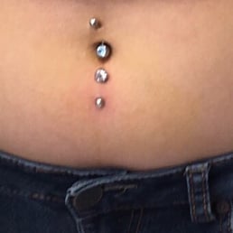 My inverse navel piercing was done here. (Don't mind the crooked top piercing, done at the boardwalk).