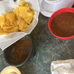 Red salsa and fresh chips Red salsa and fresh chips