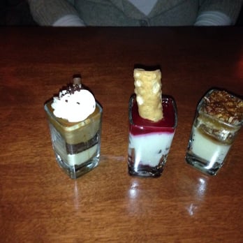 Seasons 52 - From left to right, chocolate espresso, raspberry cannolli, pecan pie, dessert cups - New American Near Me - Mclean, Virginia