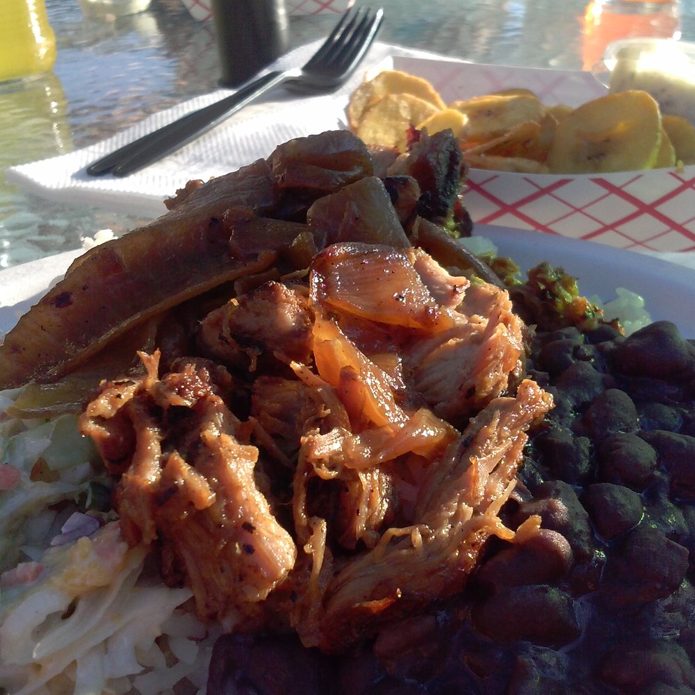 Bongos - The desi! $8.99, citrus braised pork served with rice, beans, slaw and a maduro. - Cuban Near Me - Seattle, Washington Bongos - The desi! $8.99, citrus braised pork served with rice, beans, slaw and a maduro. - Cuban Near Me - Seattle, Washington