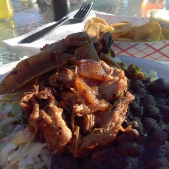 Bongos - The desi! $8.99, citrus braised pork served with rice, beans, slaw and a maduro. - Cuban Near Me - Seattle, Washington Bongos - The desi! $8.99, citrus braised pork served with rice, beans, slaw and a maduro. - Cuban Near Me - Seattle, Washington