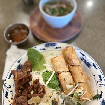 Saigon Corner - B10 with beef and egg rolls and a side of broth. - Vietnamese Near Me - San Diego, California