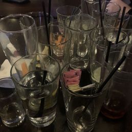 Glasses that sat at the table for over an hour.  Busser passed by numerous times and looked and kept walking.