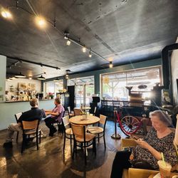 Arcadia Valley Coffee Company - Cafe lounge with tables, chairs, sofa, and arm chairs