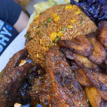AfroEatz - The Jollof Rice + Wings plate. Came with plantains and cabbage. - African Near Me - Sacramento, California AfroEatz - The Jollof Rice + Wings plate. Came with plantains and cabbage. - African Near Me - Sacramento, California