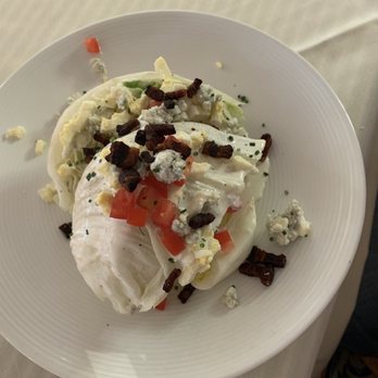 Coles 735 Main - Iceberg Wedge Salad - Hard cooked egg, chives, tomatoes, house-made Makers 46 stave smoked bacon, crumbled gorgonzola, with bleu - New American Near Me - Lexington, Kentucky Coles 735 Main - Iceberg Wedge Salad - Hard cooked egg, chives, tomatoes, house-made Makers 46 stave smoked bacon, crumbled gorgonzola, with bleu - New American Near Me - Lexington, Kentucky