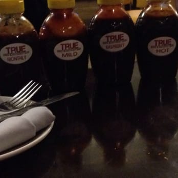 True Eats & Drinks - BBQ sauces at the table - Barbeque Near Me - Munster, Indiana