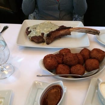 Tellers An American Chophouse - Baseball sized tater tots and ribeye covered in blue cheese! - Steakhouses Near Me - Islip, New York Tellers An American Chophouse - Baseball sized tater tots and ribeye covered in blue cheese! - Steakhouses Near Me - Islip, New York
