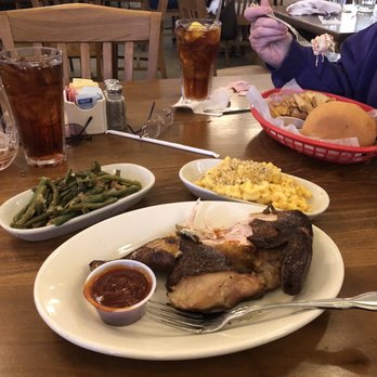 Wunsche Bros Cafe & Saloon - Smoked chicken with Mac n cheese and green beans. Across the table is a pulled pork sandwich - Burgers Near Me - Spring, Texas
