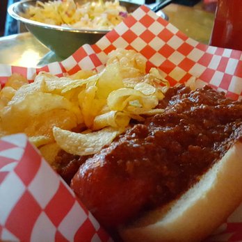 The Shed - The Shed (Salado) - the Puppy Dog (1/4 lb) plus chili and side of slaw (background) with kettle chips - Pizza Near Me - Salado, Texas The Shed - The Shed (Salado) - the Puppy Dog (1/4 lb) plus chili and side of slaw (background) with kettle chips - Pizza Near Me - Salado, Texas