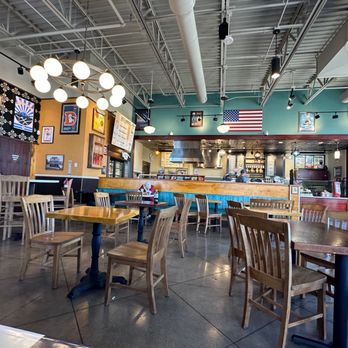 Potbelly - A view of the restaurant from the seats along the far wall. - Sandwiches Near Me - Lone Tree, Colorado Potbelly - A view of the restaurant from the seats along the far wall. - Sandwiches Near Me - Lone Tree, Colorado