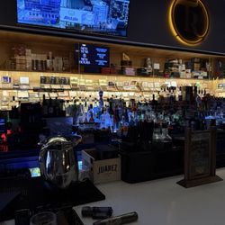 Tasting Room - Back bar with glass wall to humidor.