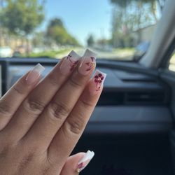 French tip with magenta flowers and golden balls