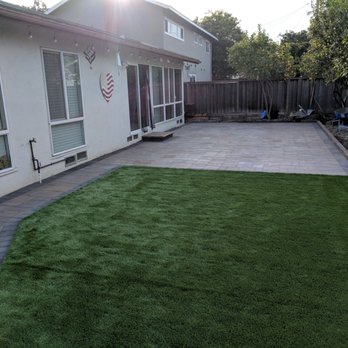 Total Landscape - Photo of the work in progress. (Belgard Catalina Grana pavers in Tuscano, with artifical turf and Melville curbing) - Landscaping Near Me Total Landscape - Photo of the work in progress. (Belgard Catalina Grana pavers in Tuscano, with artifical turf and Melville curbing) - Landscaping Near Me