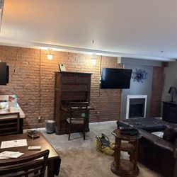 Gaffer Inn - Room 1: fireplace, couch, kitchenette, seating