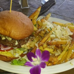 Magnolia Pointe Grill - Magnolia Point Grill Burger, with grass fed, in house ground beef. Garlic parmesan fries, and a flower :). $9.50. Very good.