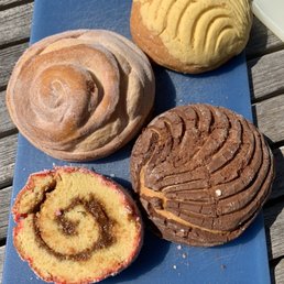 Clockwise: Novia, vanilla concha, chocolate concha, nino envuelta Clockwise: Novia, vanilla concha, chocolate concha, nino envuelta