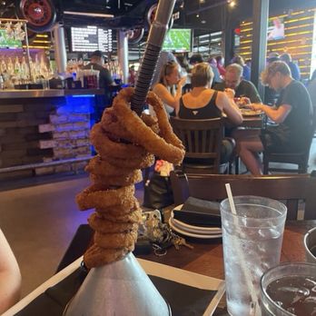 Ford's Garage Gainesville - Giant funnel tower of jumbo piston onion rings - Burgers Near Me - Gainesville, Florida Ford's Garage Gainesville - Giant funnel tower of jumbo piston onion rings - Burgers Near Me - Gainesville, Florida