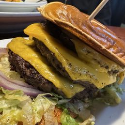 And this is what I received three patties, not smashed no bacon, wilted, lettuce, no tomato, and two single rings of onion