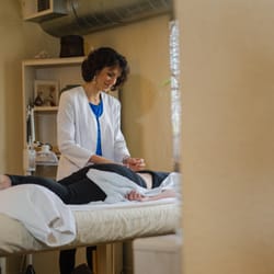 Setareh Moafi, L.Ac. with a patient.
