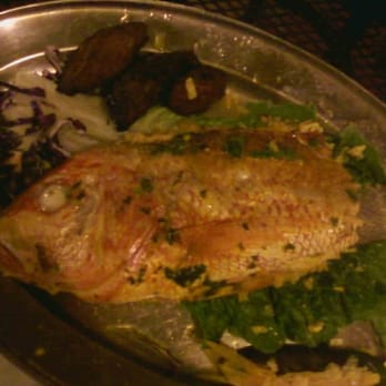 La Parrilla - Red snapper stuffed with seafood paella, with a side of fried sweet plantains.  Delicious! - Latin American Near Me - Luquillo, Puerto Rico