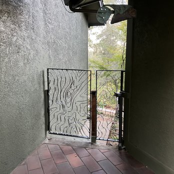 Merlin Metals - "Topograin" metal breezeway gate. Replacing old wooden gate. Custom design. - Fences & Gates Near Me - Nevada City, California Merlin Metals - "Topograin" metal breezeway gate. Replacing old wooden gate. Custom design. - Fences & Gates Near Me - Nevada City, California