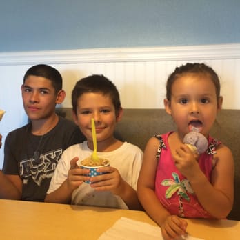 Mighty Moo Ice Cream - (From right to left) kids enjoying banana cream pie, Kahlua fudge brownie, and blueberry ice cream! And they're satisfied! - Ice Cream & Frozen Yogurt Near Me - Youngtown, Arizona