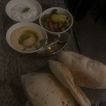 Ammatoli - Freekeh with cucumber & yogurt salad Spicy Hummus Mezza Pickles & Olives - Mediterranean Near Me - Long Beach, California Ammatoli - Freekeh with cucumber & yogurt salad Spicy Hummus Mezza Pickles & Olives - Mediterranean Near Me - Long Beach, California