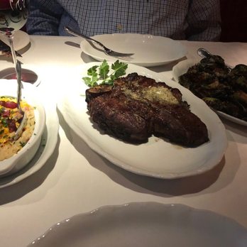 Vito's Chop House - Pancetta and aged cheddar Mashed potatoes, prime dry Aged Steak, and crispy brussels sprouts. - Italian Near Me - Orlando, Florida