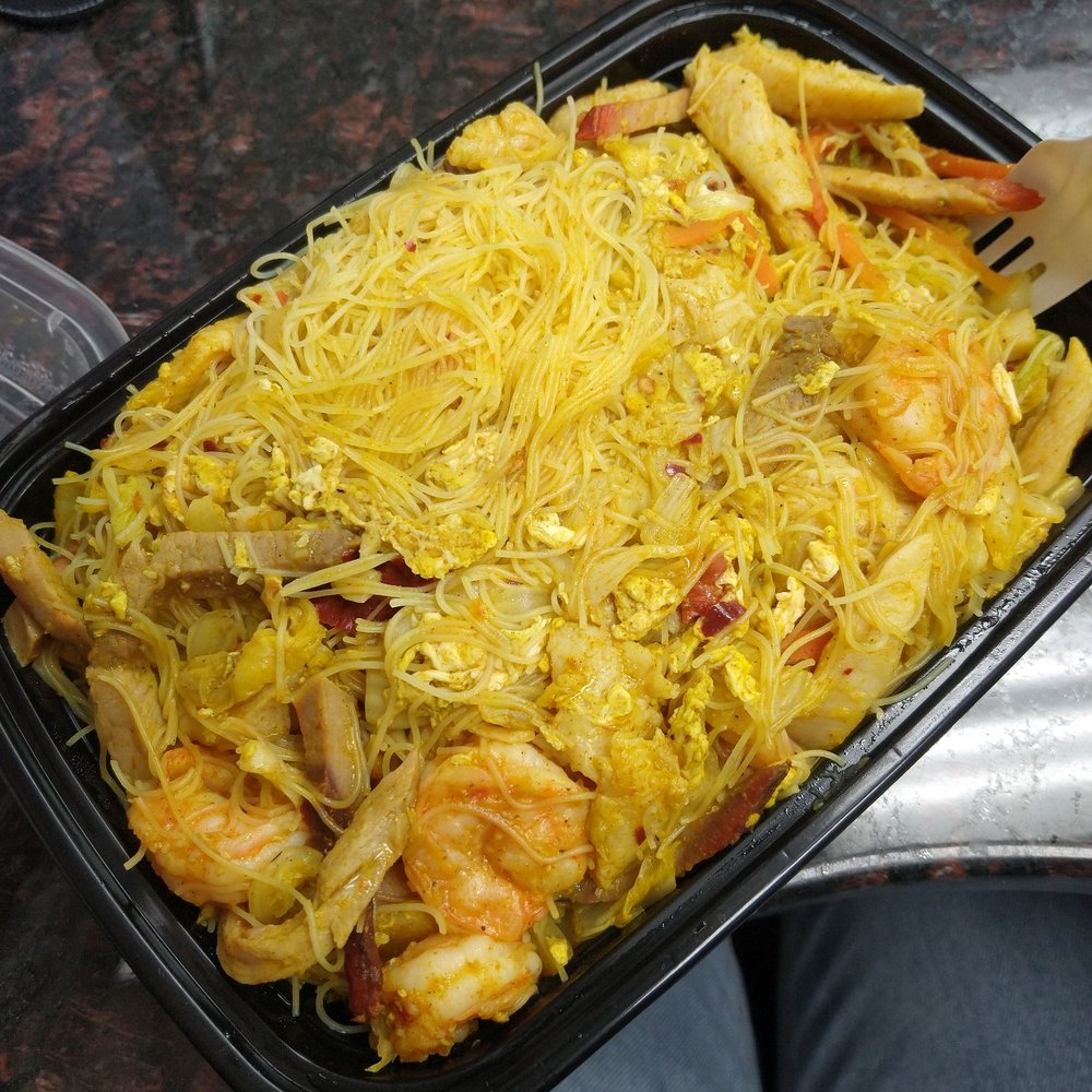a tray of noodles and shrimp a tray of noodles and shrimp