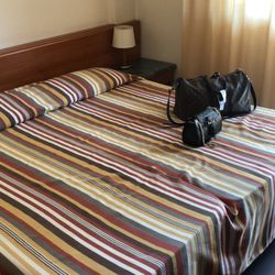 Hotel Sisto V - The comforter for the bed was thin and smelly. Very worn and dated. Nothing like the photos on Travelocity. Very misleading!