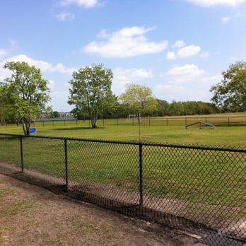 Barber Park - View from dog park, notice agility equipment. Lake in background - Dog Parks Near Me - Orlando, Florida