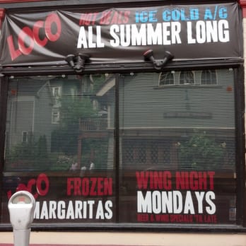 Loco Cantina - a sign in the window of a restaurant - Lounges Near Me - Ithaca, New York