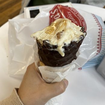 Laura's Candies - a hand holding an ice cream cone - Candy Stores Near Me - Metairie, Louisiana