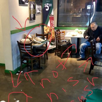 Wingstop - The filthy dining area. The guy in the photo had to sit at one of the many dirty tables just to wait on his order....not even his trash. - Chicken Wings Near Me - Moreno Valley, California Wingstop - The filthy dining area. The guy in the photo had to sit at one of the many dirty tables just to wait on his order....not even his trash. - Chicken Wings Near Me - Moreno Valley, California