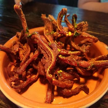La Taberna - The pig ear - SO GOOD! delicious chili sauce and the perfect blend of meaty and crispy - Spanish Near Me - Napa, California