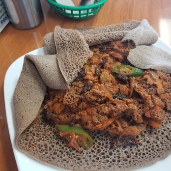 Ethio Coffee House - Quanta Firfir-dried beef in stew on injera. They brought the spice level down for me. It was still spicy but delicious. - Coffee & Tea Near Me - Nashville, Tennessee